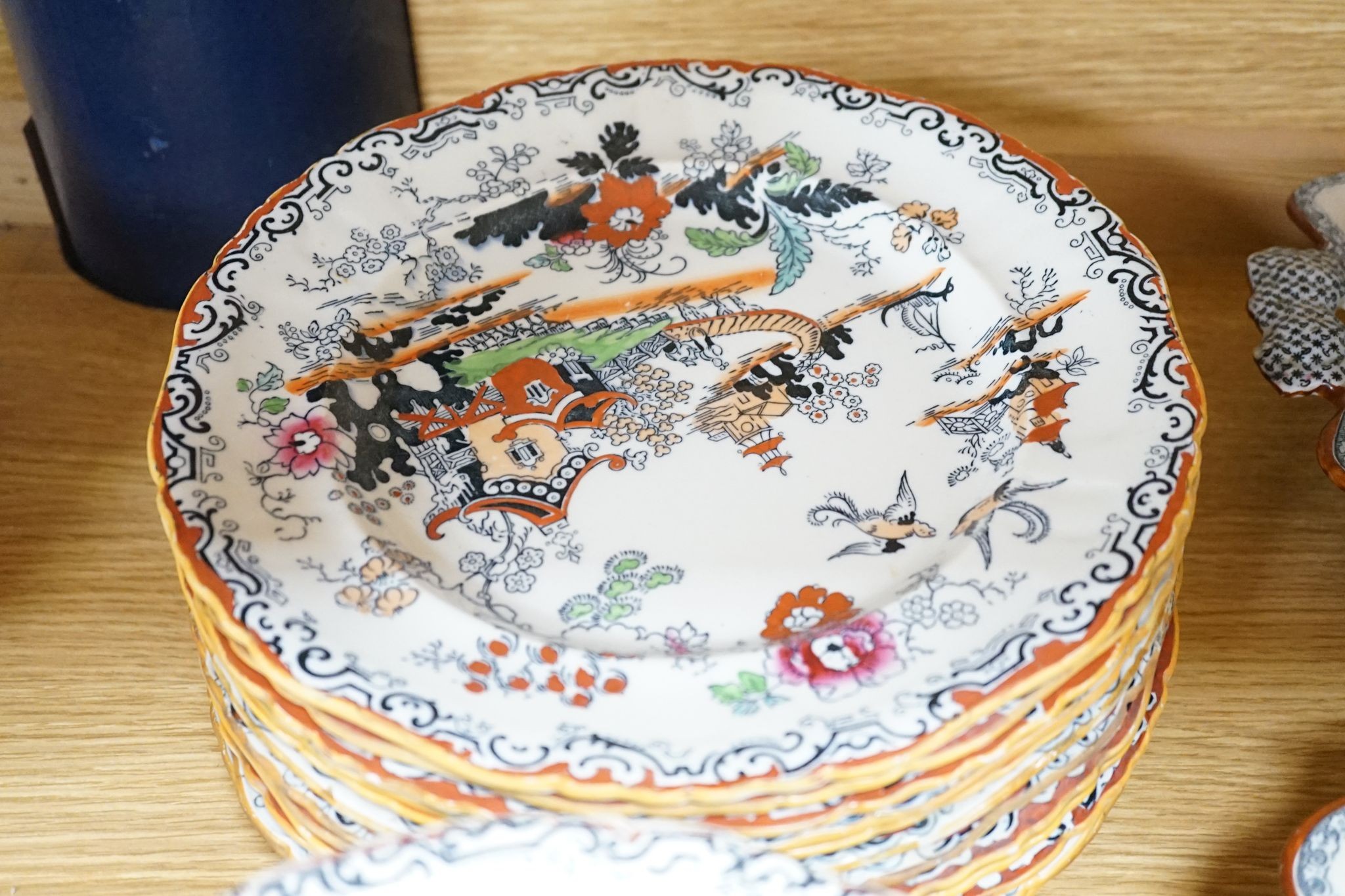 An Ashworths ironstone landscape pattern part dinner service